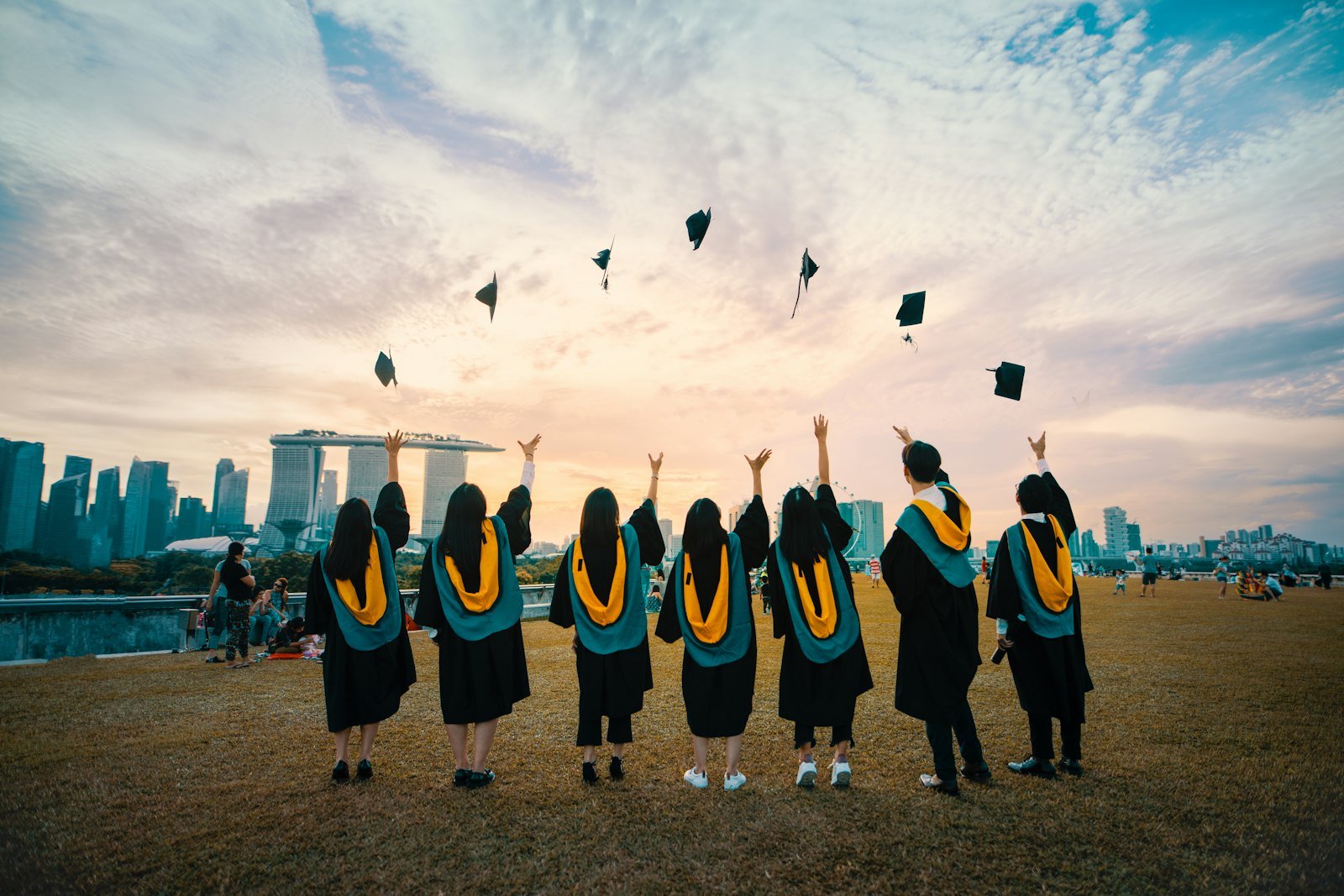 Graduates celebrating at the end of their degree