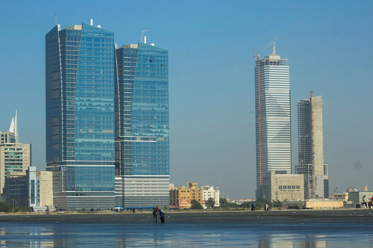 The Karachi skyline, reflecting Laira's Pakistan-rooted, globally informed methodology